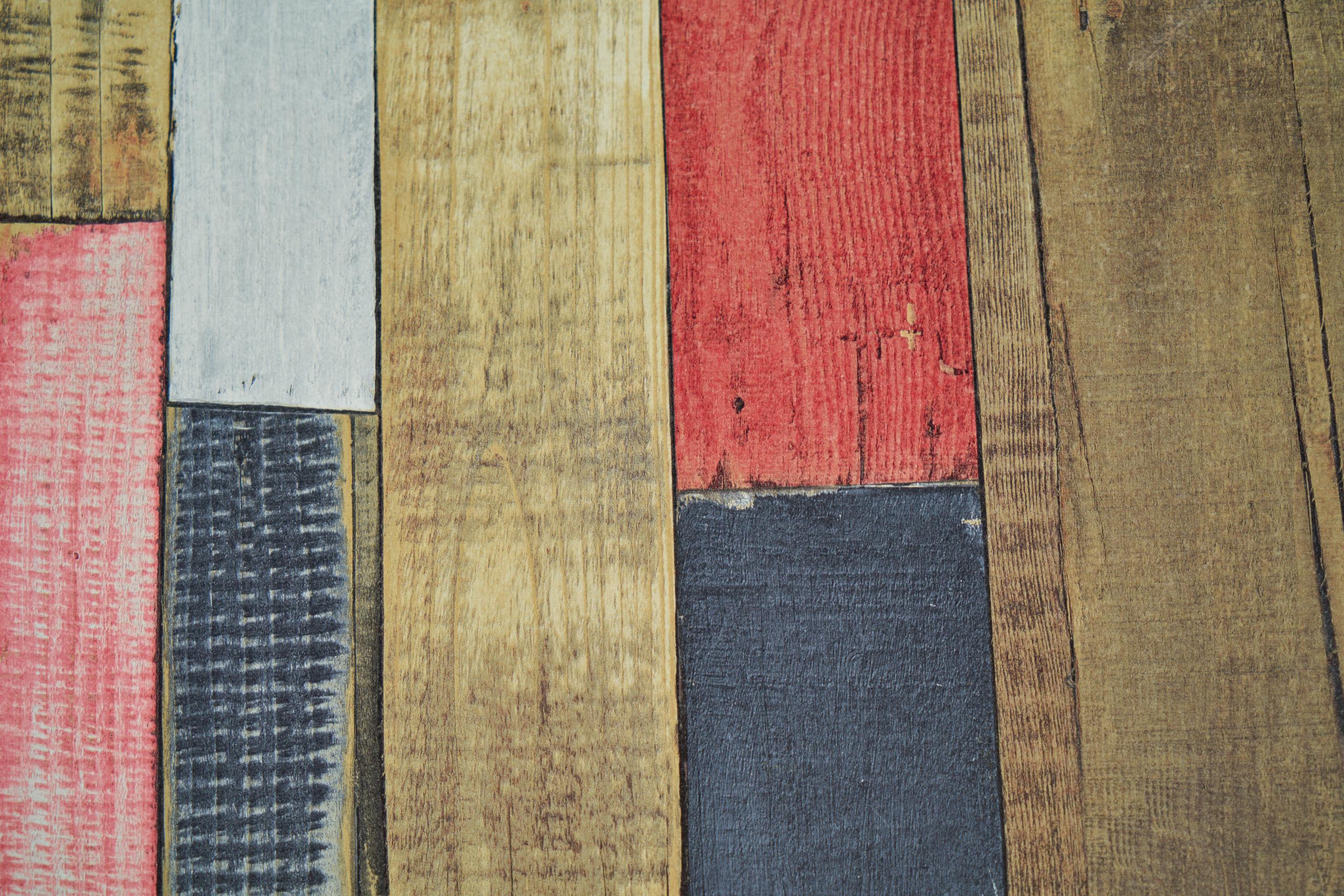 A vibrant arrangement of wooden planks in a rustic pattern, showcasing natural and painted textures.
